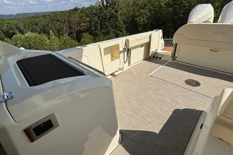  Yacht Photos Pics 2021 Chris-Craft Calypso 35 boat deck with seating and scenic forest view.