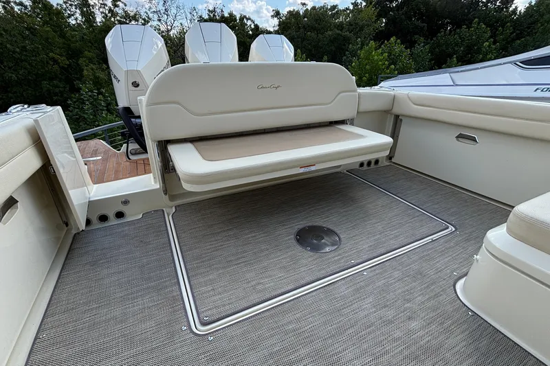  Yacht Photos Pics 2021 Chris-Craft Calypso 35 boat interior with foldable seating and outboard motors.