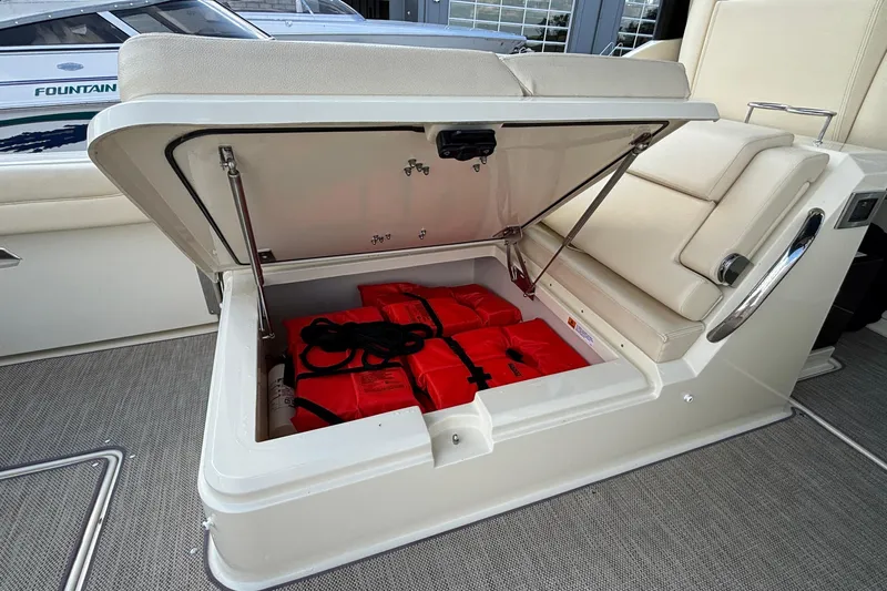  Yacht Photos Pics Storage compartment on 2021 Chris-Craft Calypso 35 boat with life jackets inside.