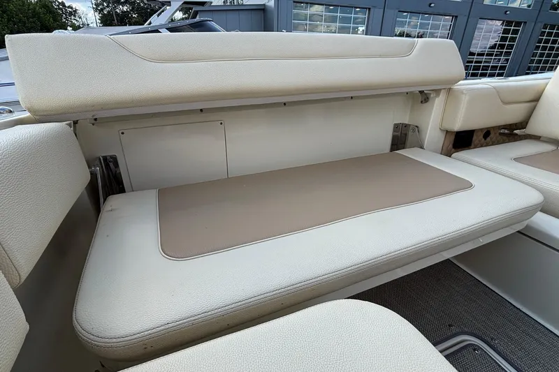  Yacht Photos Pics 2021 Chris-Craft Calypso 35 boat interior seating with beige and cream upholstery.