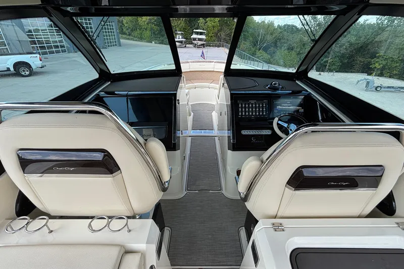  Yacht Photos Pics 2021 Chris-Craft Calypso 35 boat interior with dual helm seats and modern dashboard.