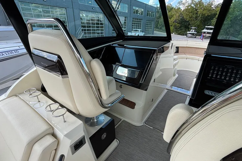  Yacht Photos Pics 2021 Chris-Craft Calypso 35 boat interior with luxurious seating and modern dashboard.