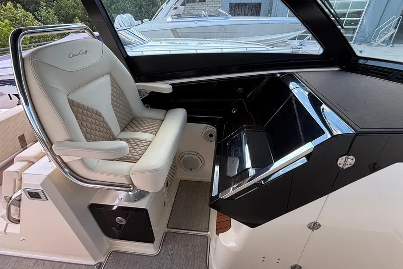  Yacht Photos Pics 2021 Chris-Craft Calypso 35 helm with luxurious seating and sleek dashboard design.