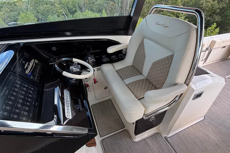 Yacht Photos Pics 2021 Chris-Craft Calypso 35 helm with luxury captain's chair and modern controls.