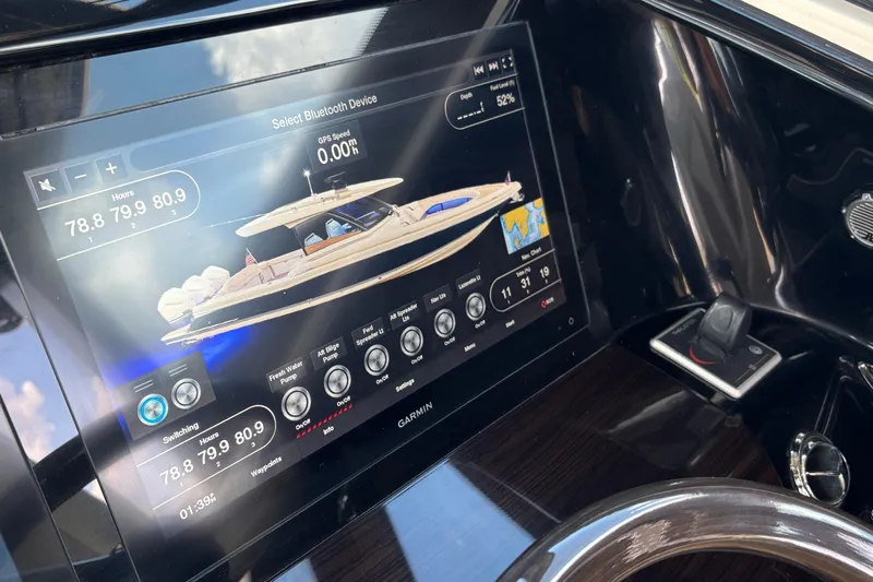  Yacht Photos Pics 2021 Chris-Craft Calypso 35 dashboard with Garmin display and controls.