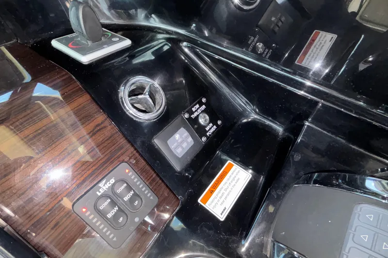  Yacht Photos Pics Control panel of 2021 Chris-Craft Calypso 35 boat, featuring Lenco trim tab controls.