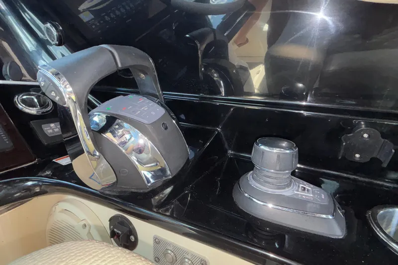  Yacht Photos Pics Control panel of 2021 Chris-Craft Calypso 35 boat, featuring throttle and joystick.