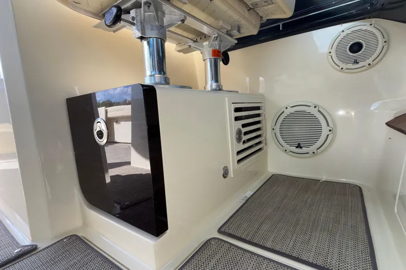  Yacht Photos Pics 2021 Chris-Craft Calypso 35 interior detail with speakers and storage compartment.