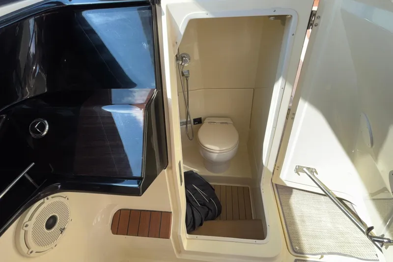  Yacht Photos Pics 2021 Chris-Craft Calypso 35 boat interior with compact bathroom and toilet.