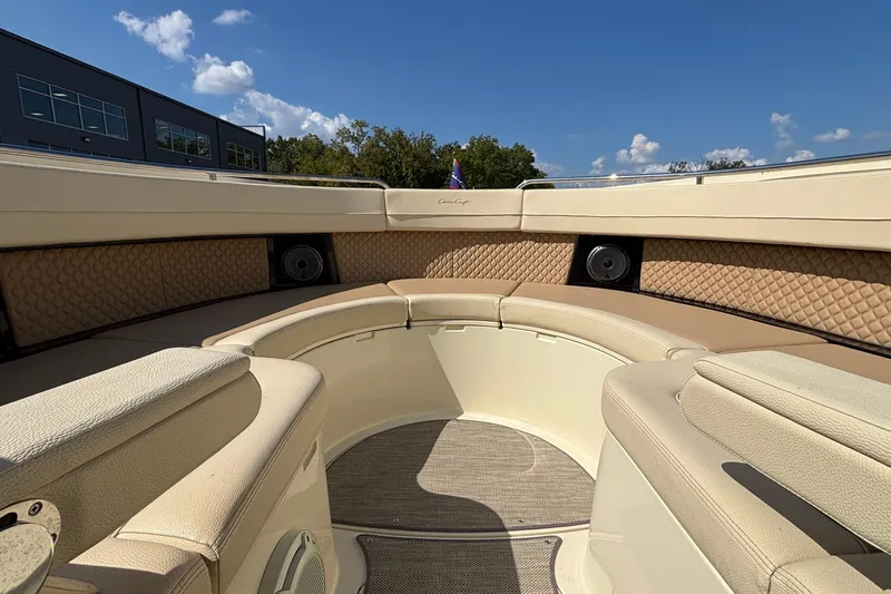  Yacht Photos Pics 2021 Chris-Craft Calypso 35 boat interior with beige seating and speakers.