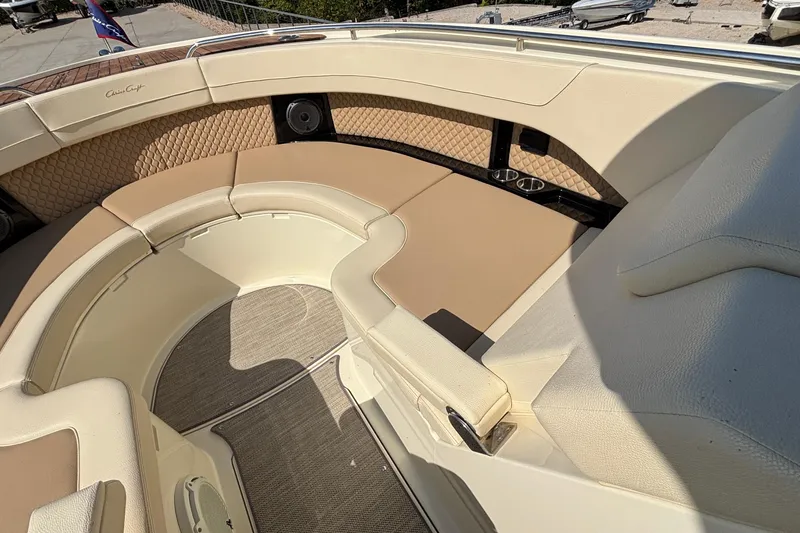  Yacht Photos Pics 2021 Chris-Craft Calypso 35 boat interior with beige seating and cup holders.
