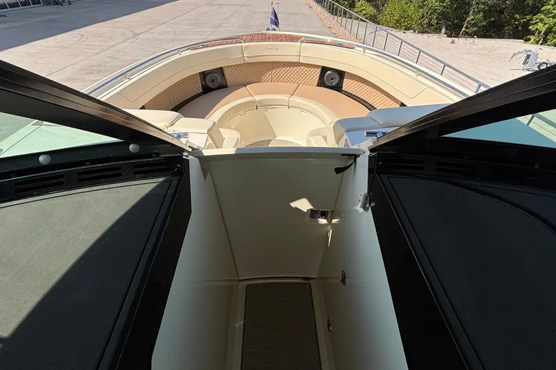  Yacht Photos Pics 2021 Chris-Craft Calypso 35 boat interior with open cabin door and seating area.