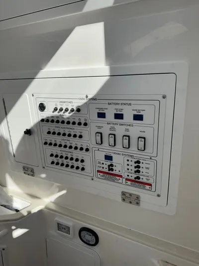  Yacht Photos Pics Electrical control panel on a 2023 Edgewater 285CC boat, featuring battery status and switches.