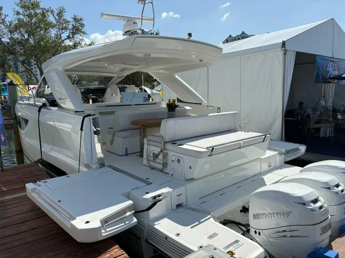 Yacht Photos Pics 2024 Jeanneau DB43 yacht with Mercury engines docked at a marina.