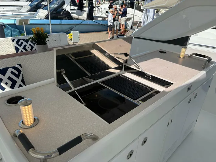 Yacht Photos Pics Outdoor kitchen on 2024 Jeanneau DB43 yacht with grill and modern design.