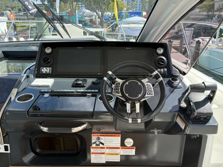  Yacht Photos Pics 2024 Jeanneau DB43 helm with advanced controls and dual displays.