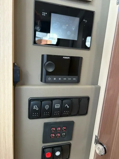  Yacht Photos Pics Control panel of 2024 Jeanneau DB43 yacht with touchscreen and switches.