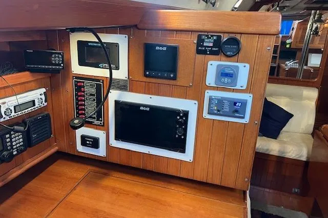 Southern Cross Yacht Photos Pics Control panel of 1987 Tayana Vancouver 42 yacht with navigation and communication equipment.