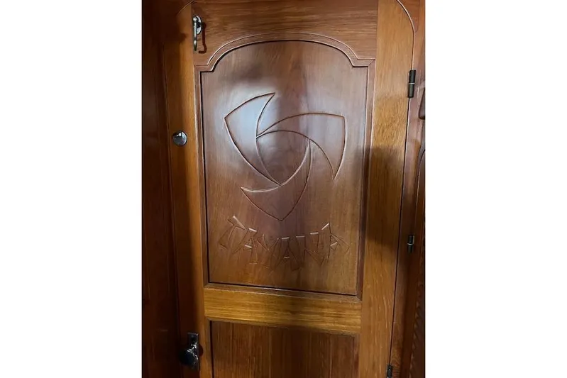 Southern Cross Yacht Photos Pics Wooden door with engraved design on a 1987 Tayana Vancouver 42 yacht.