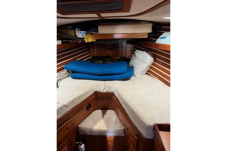 Southern Cross Yacht Photos Pics Interior cabin of 1987 Tayana Vancouver 42 sailboat with wooden finish and cushions.