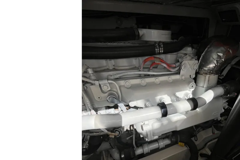  Yacht Photos Pics Engine compartment of a 2004 Cabo 35 Express boat, showcasing detailed components.