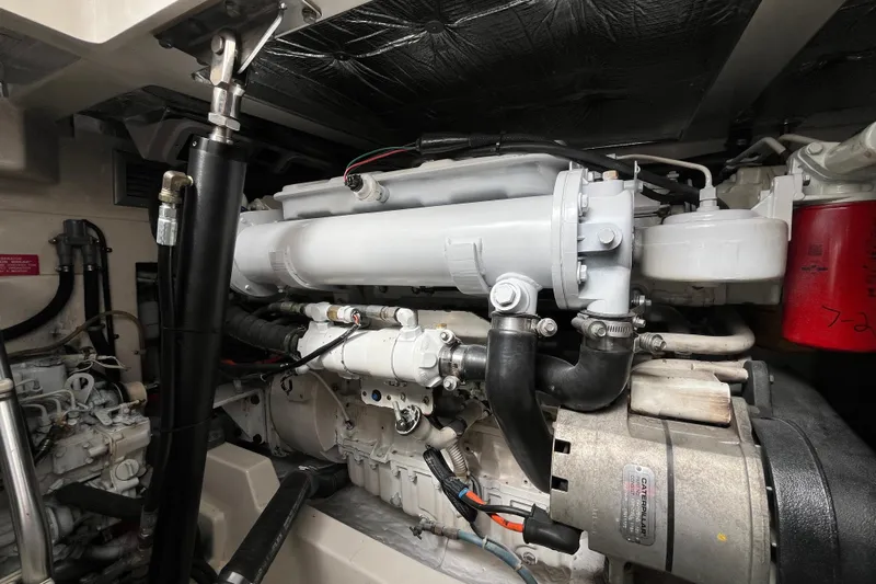  Yacht Photos Pics Engine compartment of a 2004 Cabo 35 Express boat, showcasing detailed mechanical components.