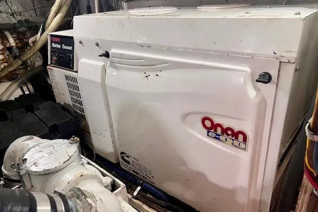 Abuelo Yacht Photos Pics Onan marine generator in 1989 HATTERES Convertible engine room.
