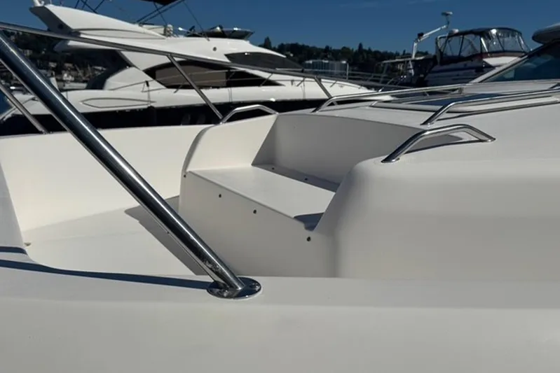 Pearl Yacht Photos Pics 1994 Sea Ray 440 Express Bridge yacht with sleek white deck and stainless steel railings.