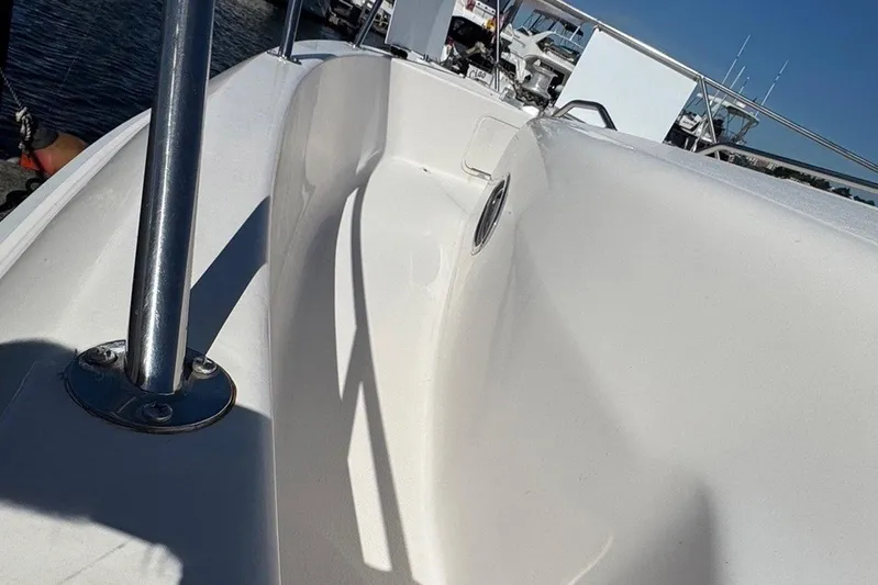 Pearl Yacht Photos Pics 1994 Sea Ray 440 Express Bridge deck with railing, docked at marina.