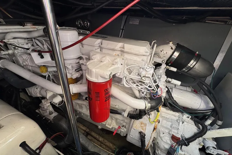 Pearl Yacht Photos Pics Engine room of a 1994 Sea Ray 440 Express Bridge, showcasing detailed machinery.