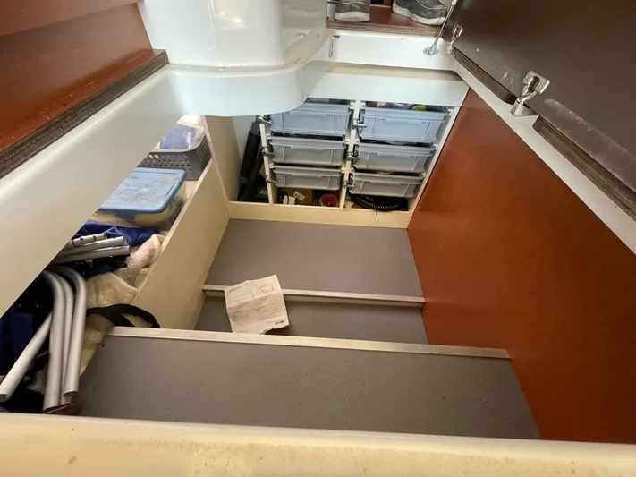 Funkytown 2 Yacht Photos Pics Storage area inside 2014 Jeanneau NC 11 boat with organized compartments and equipment.