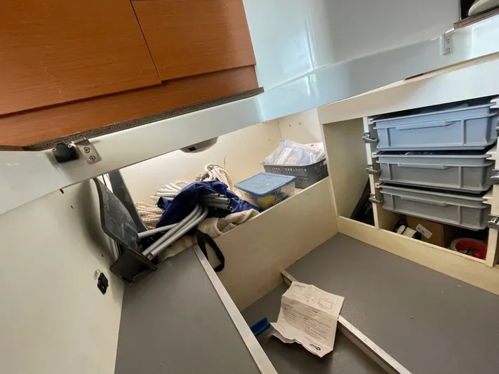 Funkytown 2 Yacht Photos Pics Storage area inside a 2014 Jeanneau NC 11 boat with organized compartments and equipment.