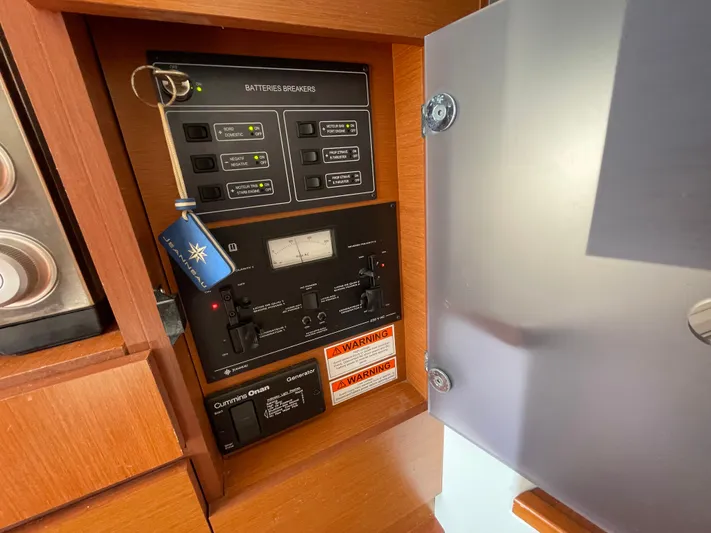 Funkytown 2 Yacht Photos Pics Electrical panel of 2014 Jeanneau NC 11 boat with battery breakers and generator controls.