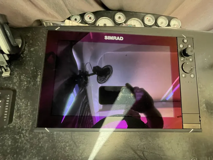 Funkytown 2 Yacht Photos Pics Simrad navigation system on 2014 Jeanneau NC 11 boat dashboard.