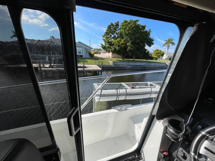 Funkytown 2 Yacht Photos Pics View from Jeanneau NC 11 boat, overlooking a serene canal and lush greenery.