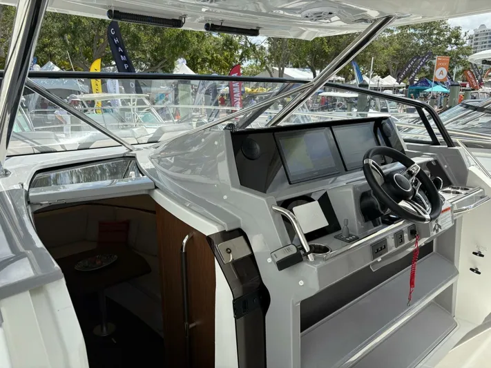 Jeanneau Yacht Photos Pics 2024 Jeanneau 12.5 Walk cockpit with modern steering and navigation displays.