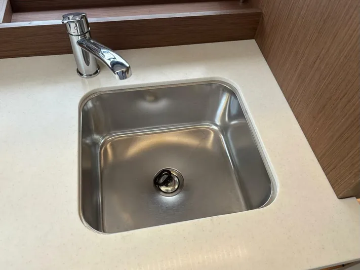 Jeanneau Yacht Photos Pics Stainless steel sink with modern faucet on Jeanneau 12.5 Walk, 2024 model.