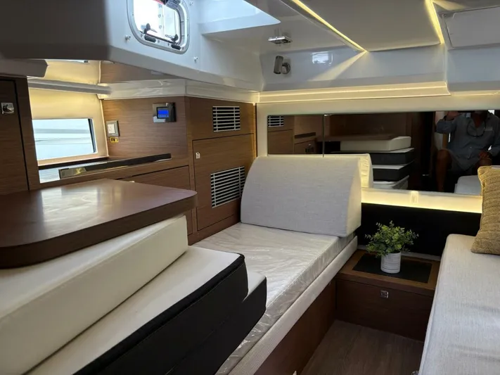 Jeanneau Yacht Photos Pics 2024 Jeanneau 12.5 Walk interior with modern design and cozy seating area.