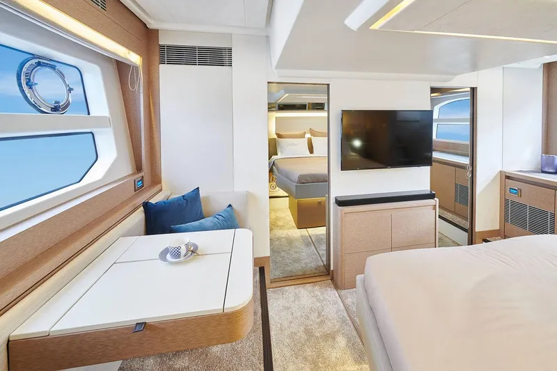  Yacht Photos Pics Manufacturer Provided Image: Luxurious interior of 2024 Prestige 590 yacht with modern furnishings and large windows.