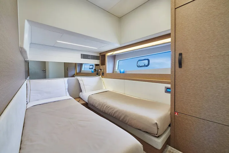  Yacht Photos Pics Manufacturer Provided Image: Luxurious twin cabin interior of 2024 Prestige 590 yacht, featuring modern design and ocean view.