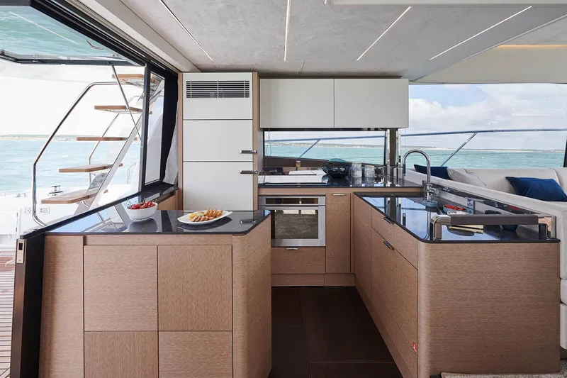  Yacht Photos Pics Manufacturer Provided Image: Luxurious kitchen interior of 2024 Prestige 590 yacht with modern appliances and ocean view.