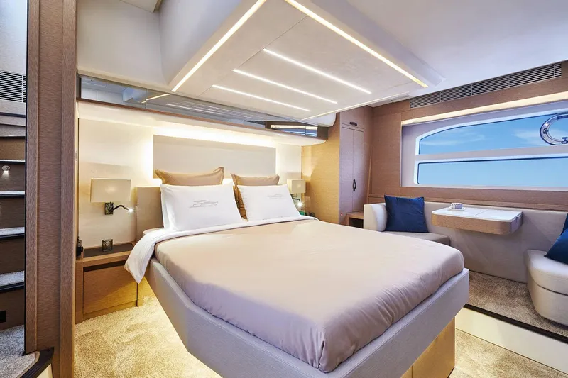  Yacht Photos Pics Manufacturer Provided Image: Luxurious 2024 Prestige 590 yacht bedroom with modern design and elegant lighting.