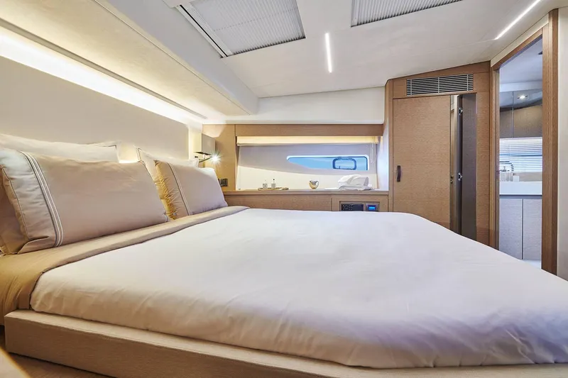  Yacht Photos Pics Manufacturer Provided Image: Luxurious bedroom interior of 2024 Prestige 590 yacht, featuring elegant design and modern amenities.