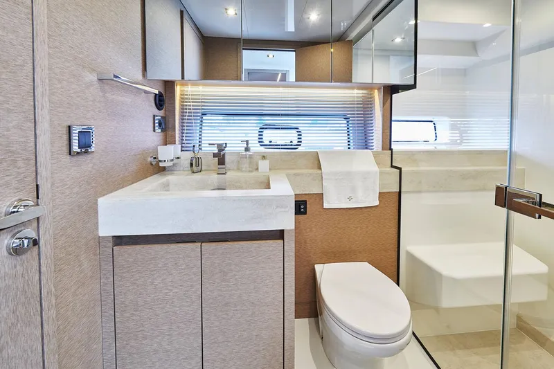  Yacht Photos Pics Manufacturer Provided Image: Luxurious bathroom in 2024 Prestige 590 yacht with modern fixtures and elegant design.