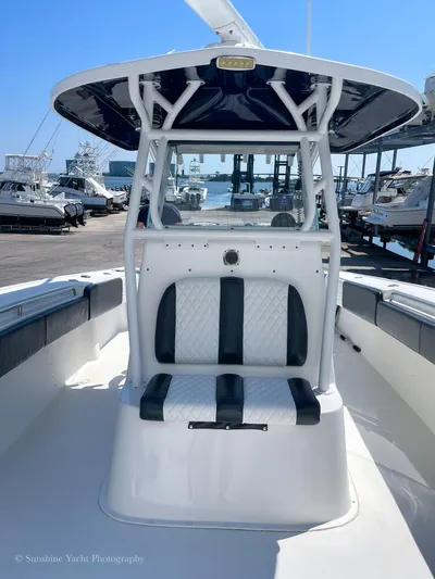 Higher Power Yacht Photos Pics 2017 Cape Horn 36XS boat with cushioned seating and T-top in marina.