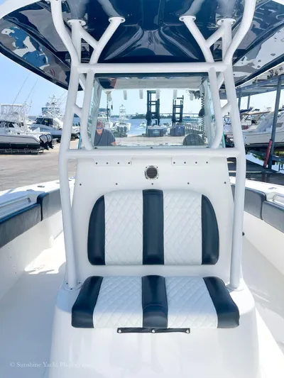 Higher Power Yacht Photos Pics 2017 Cape Horn 36XS boat interior with cushioned seating and marina background.