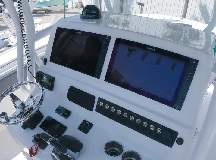 Higher Power Yacht Photos Pics 2017 Cape Horn 36XS boat dashboard with dual Simrad displays and steering wheel.
