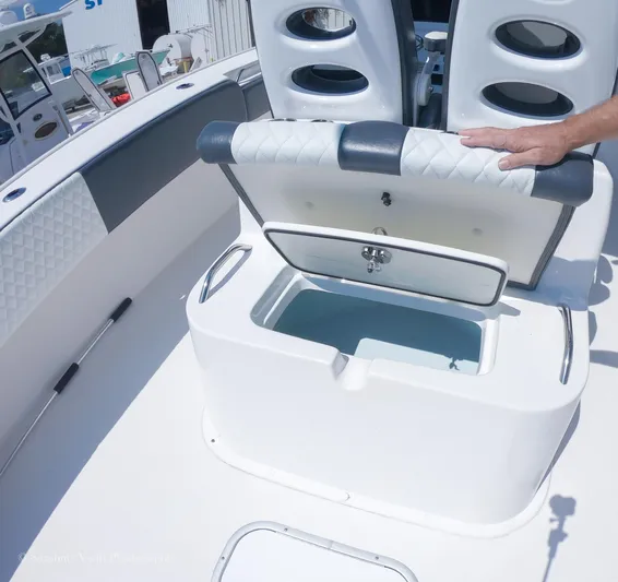 Higher Power Yacht Photos Pics 2017 Cape Horn 36XS boat with open storage compartment and cushioned seating.