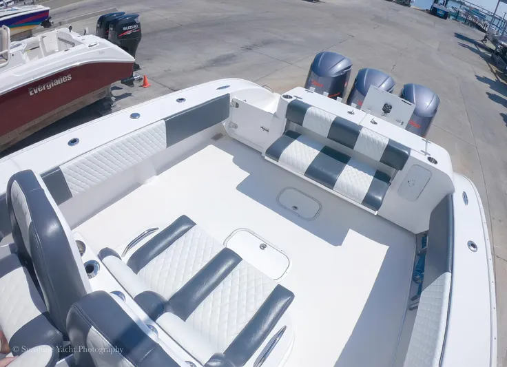 Higher Power Yacht Photos Pics 2017 Cape Horn 36XS boat interior with cushioned seating and triple outboard engines.