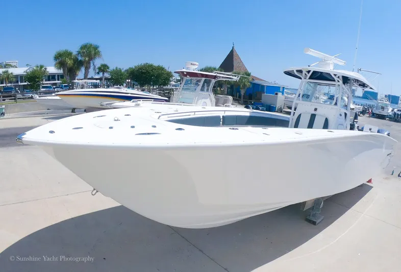 Higher Power Yacht Photos Pics 2017 Cape Horn 36XS boat docked at a marina under clear blue sky.
